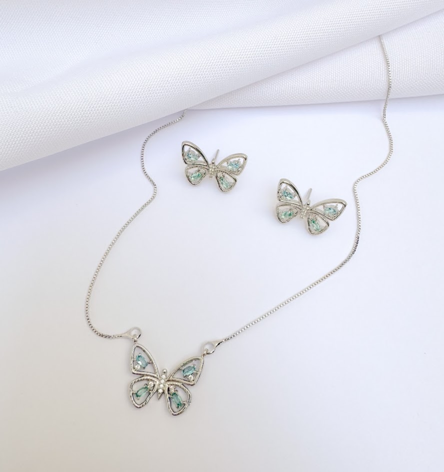 Conjunto Borboleta com Navete e Cristal Azul Banho Branco